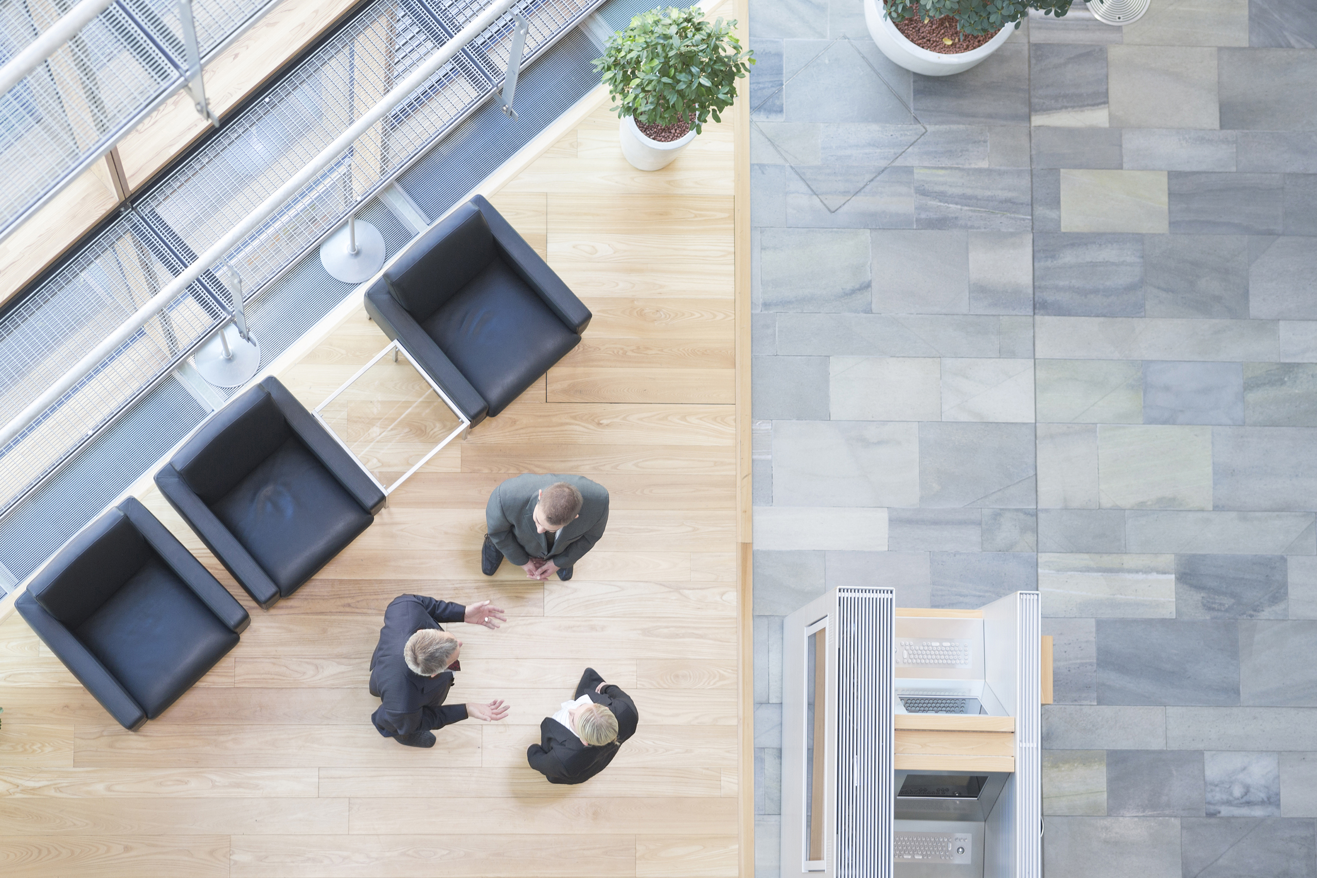 Three business people communicating