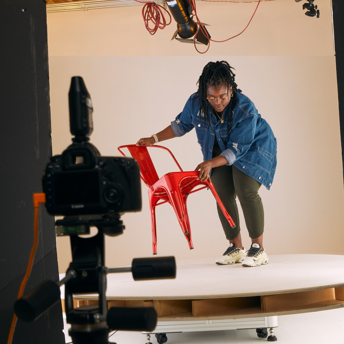 Content creation team setting up a photo studio for a shoot