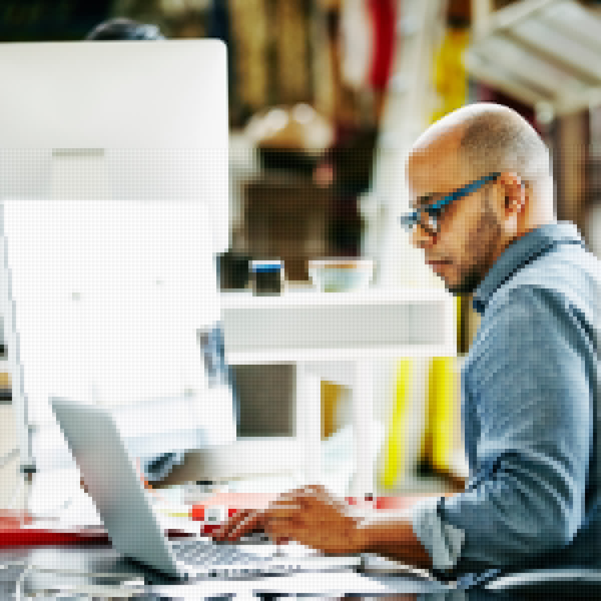 Marketer working on premedia and adaptive design